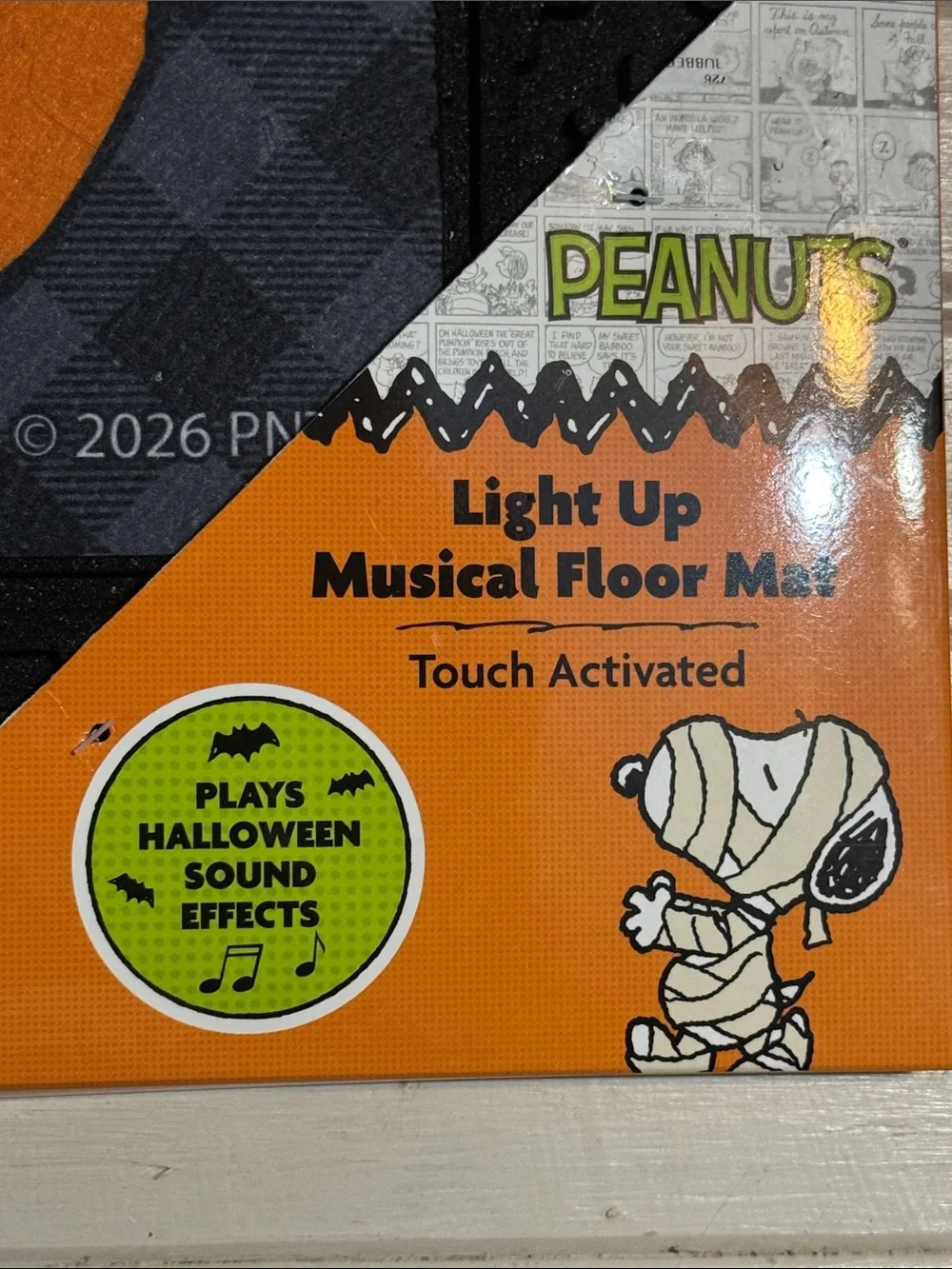 Musical Peanuts Halloween Doormat with Snoopy in a jack o lantern with Woodstock